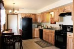 Updated Kitchen with beautiful wood cabinets and Granite Tile Counters